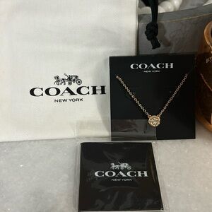 Coach open circle necklace in rose gold